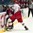 SPISSKA NOVA VES, SLOVAKIA - APRIL 23: Ilya Gurban #14 of Belarus takes out Latvia's Viktors Jasunovs #22 during relegation round action at the 2017 IIHF Ice Hockey U18 World Championship. (Photo by Steve Kingsman/HHOF-IIHF Images)

